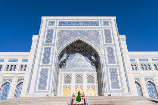 Beautiful Islamic facade with intricate patterns in Tashkent, showcasing unique architectural design.