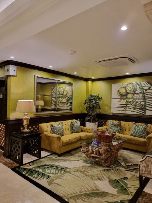 Free A stylish hotel lounge with luxurious seating and modern decor, creating a warm atmosphere. Stock Photo