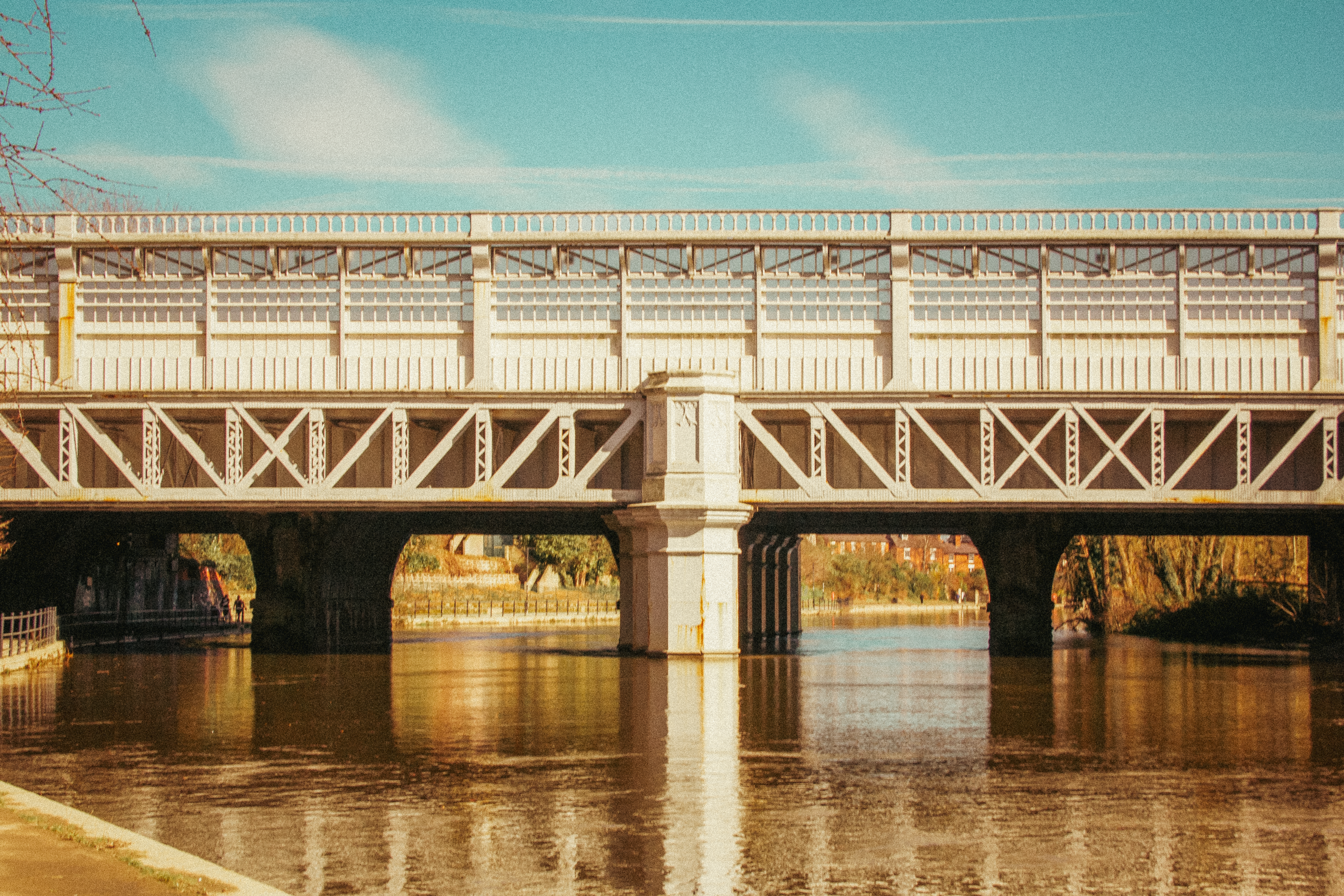 A vibrant view of the historic metal bridge over the River Severn in Shrewsbury, England.