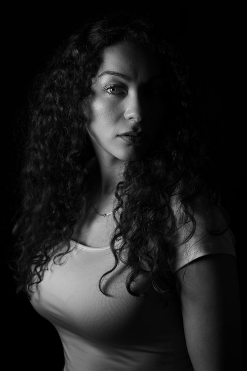 Portrait of Woman with Curly Hair in Black and White · Free Stock Photo