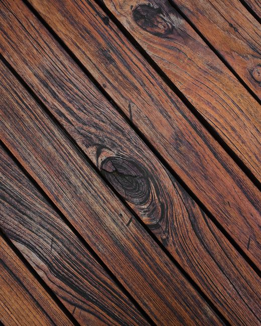 Detailed view of weathered wooden planks showing natural grain and texture.