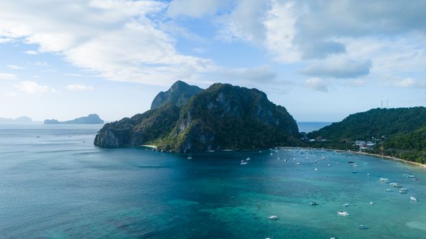 Explore the stunning El Nido island with turquoise waters and lush karst cliffs.