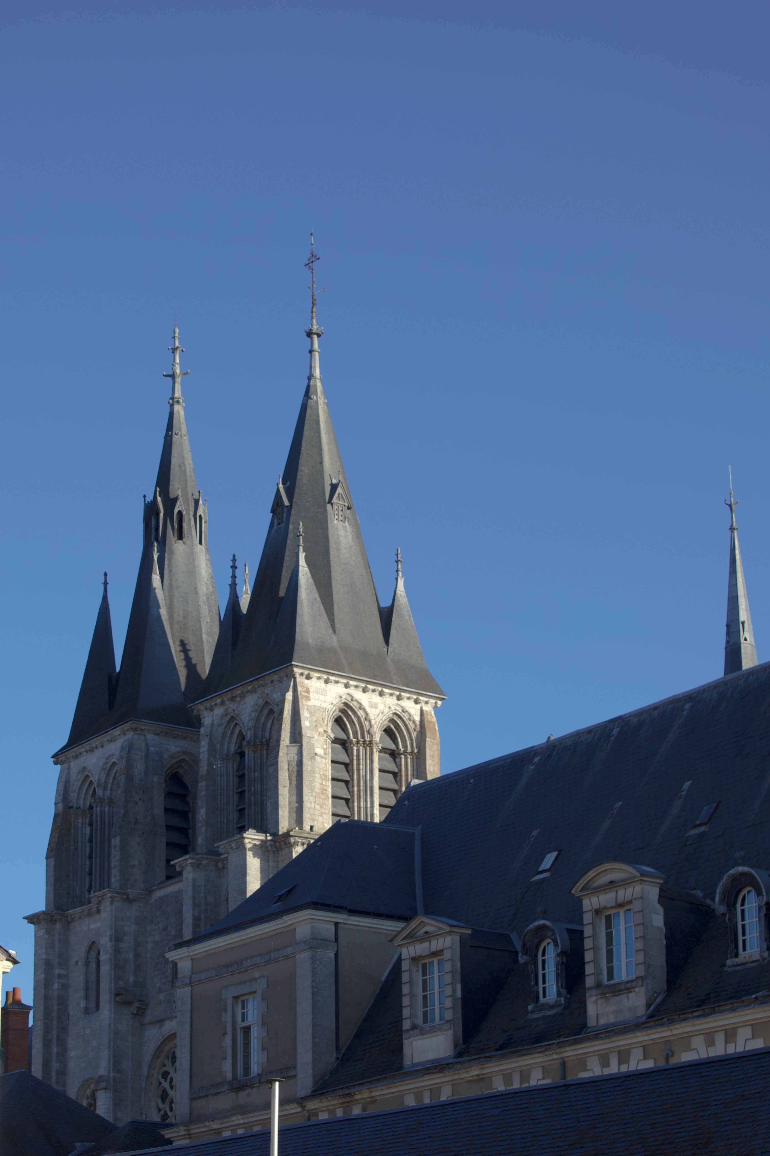Gothic Cathedral Spires Against Blue Sky · Free Stock Photo