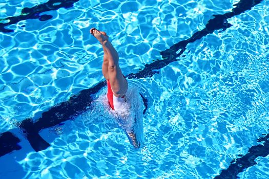 Woman in White and Red Swimsuit iDiving in Water