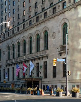 Stunning view of the historic Fairmont Royal York Hotel with flags and architectural details in Toronto, Canada.