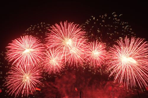 Free Dazzling fireworks burst in the night sky, creating a vibrant spectacle. Stock Photo