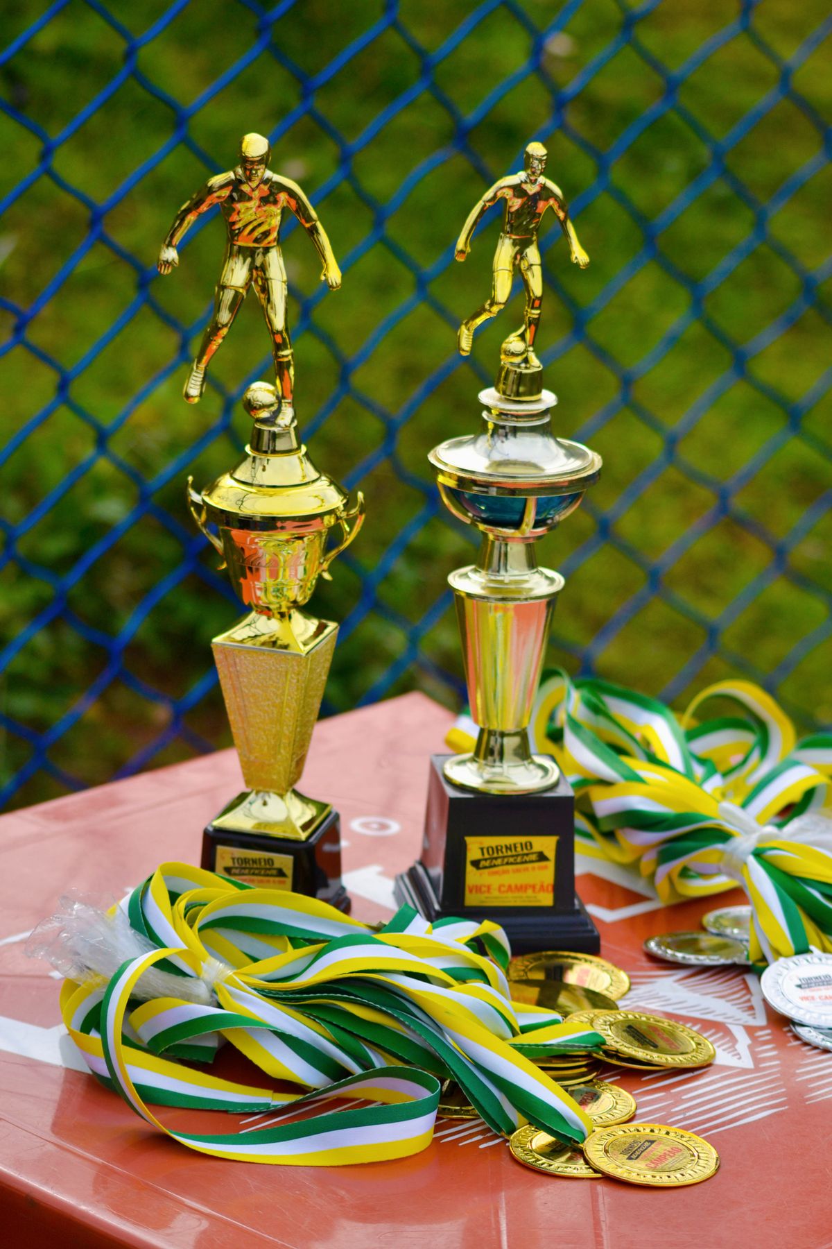 Karate medalists celebrating on the podium