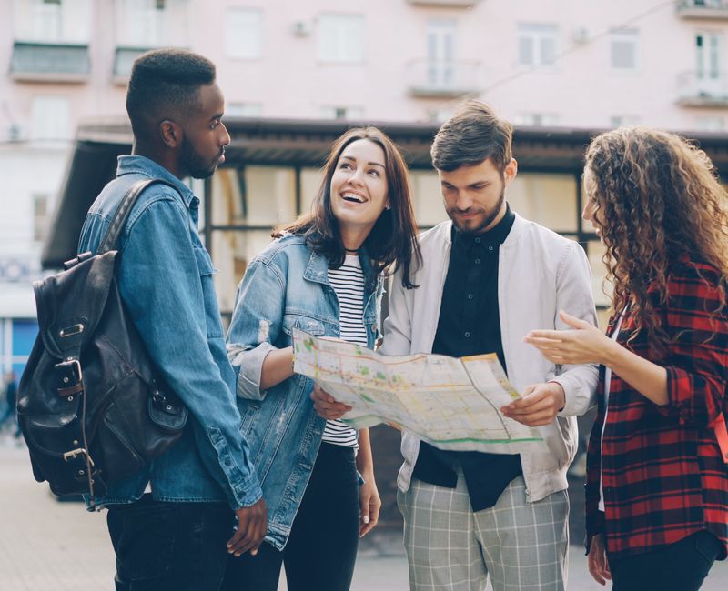 A group of friends discussing travel plans