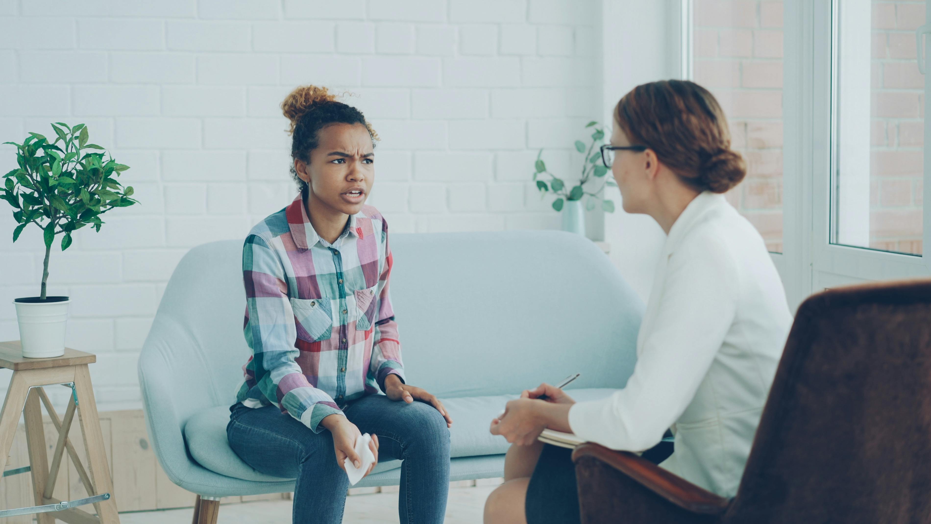Therapist and patient in conversation during a counseling session