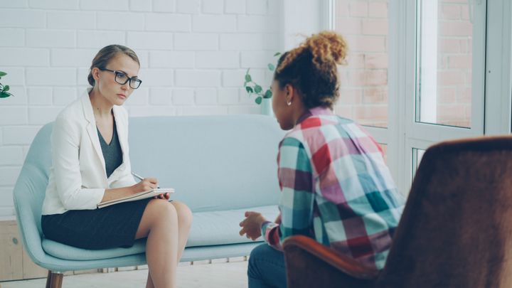 A therapist listening to a client