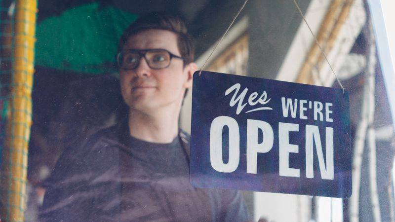 Open sign in a storefront door