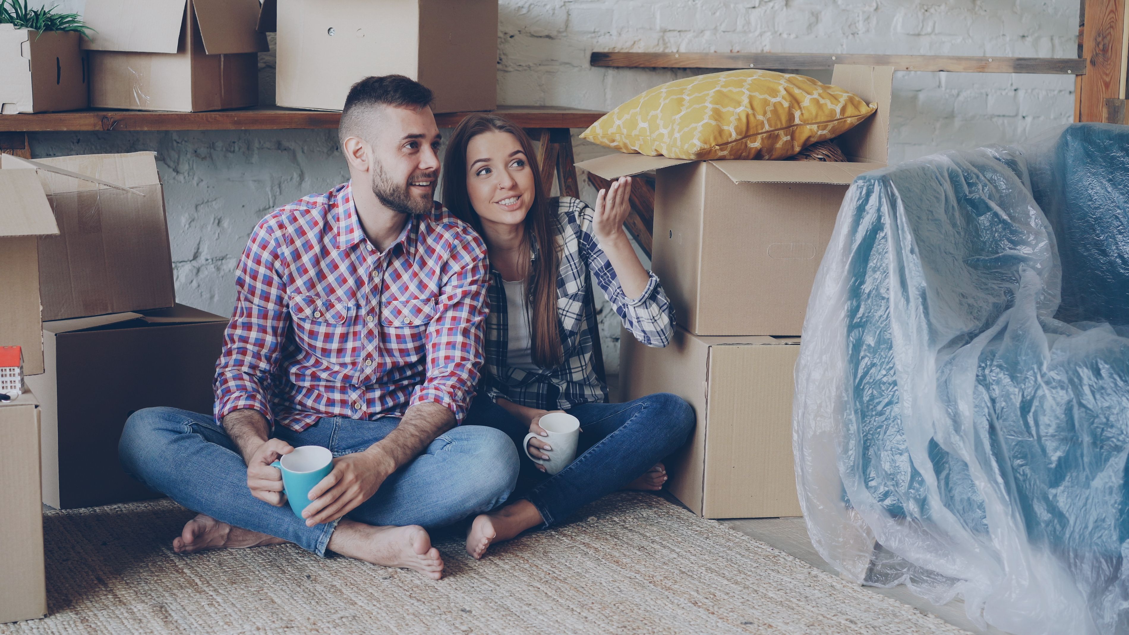 A couple sitting on the floor