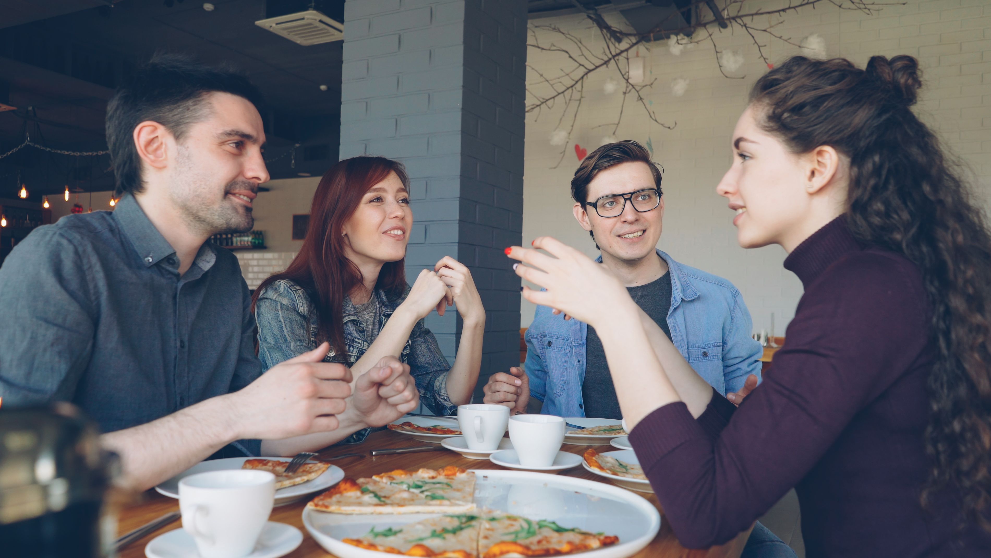 Couple meeting for first date at coffee shop