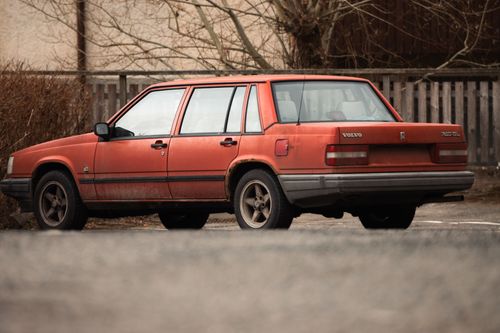 Free A classic red Volvo 740 GL car parked outdoors in winter, highlighting vintage automotive design in a Swedish setting. Stock Photo