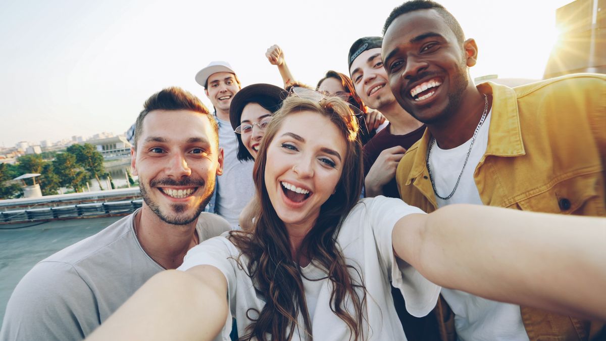 Diverse group of friends taking a selfie outdoors