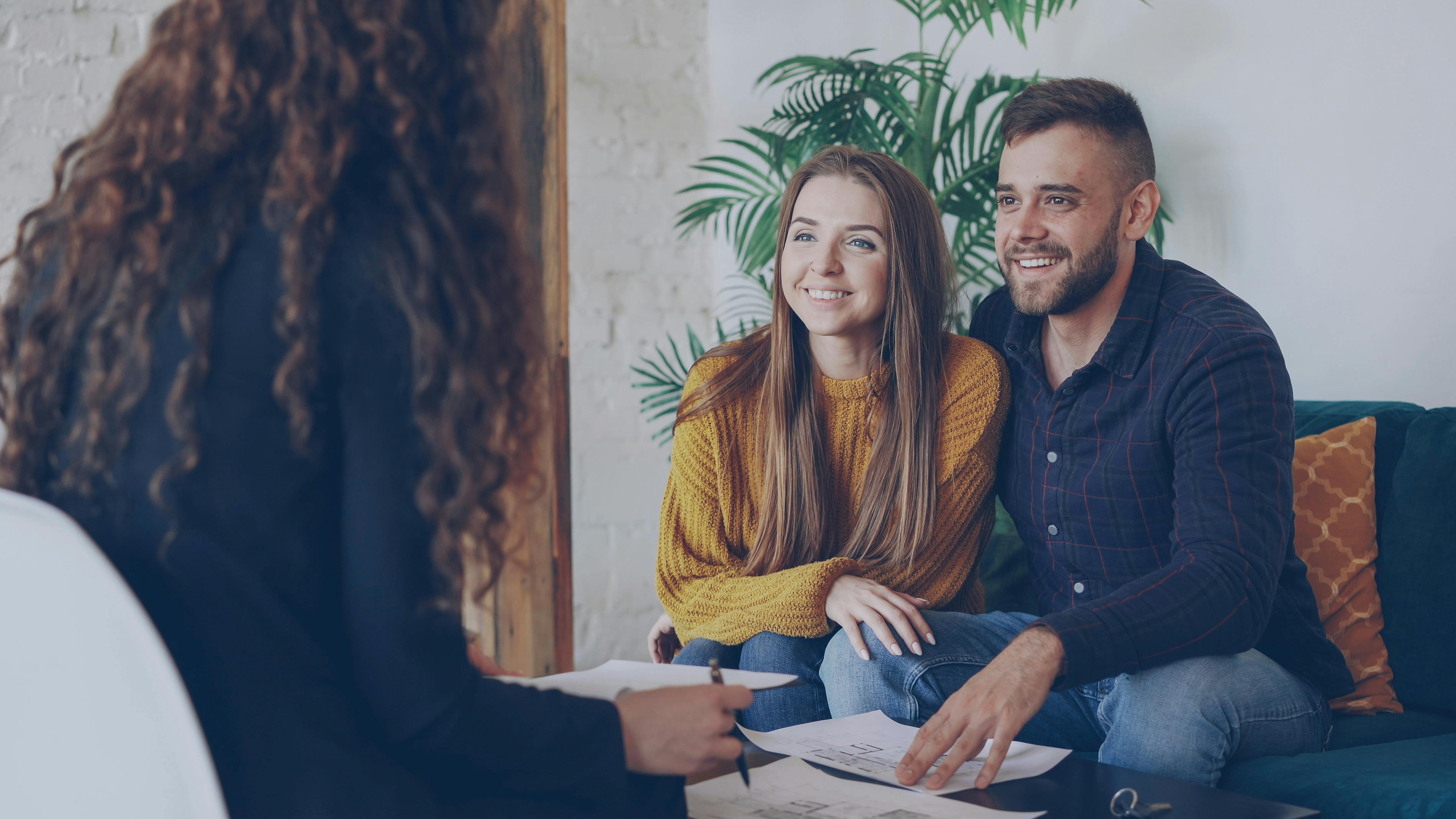 Image File Name: closing-costs-guide
Image Alt Text: Couple meeting with a real estate professional to discuss closing costs
Image Caption: Working with a top real estate agent helps buyers prepare for expenses that occur before closing.