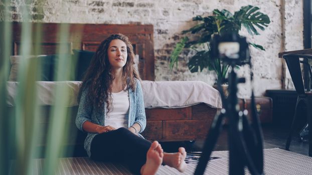 Casual video shoot with a young woman at home.