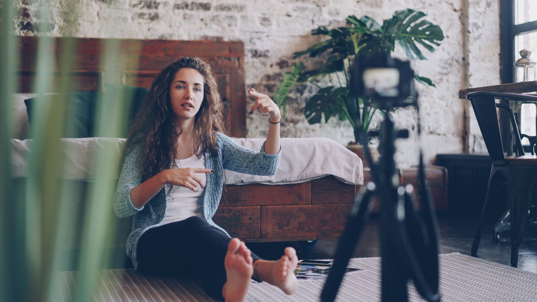Creator filming a video at home with a camera setup