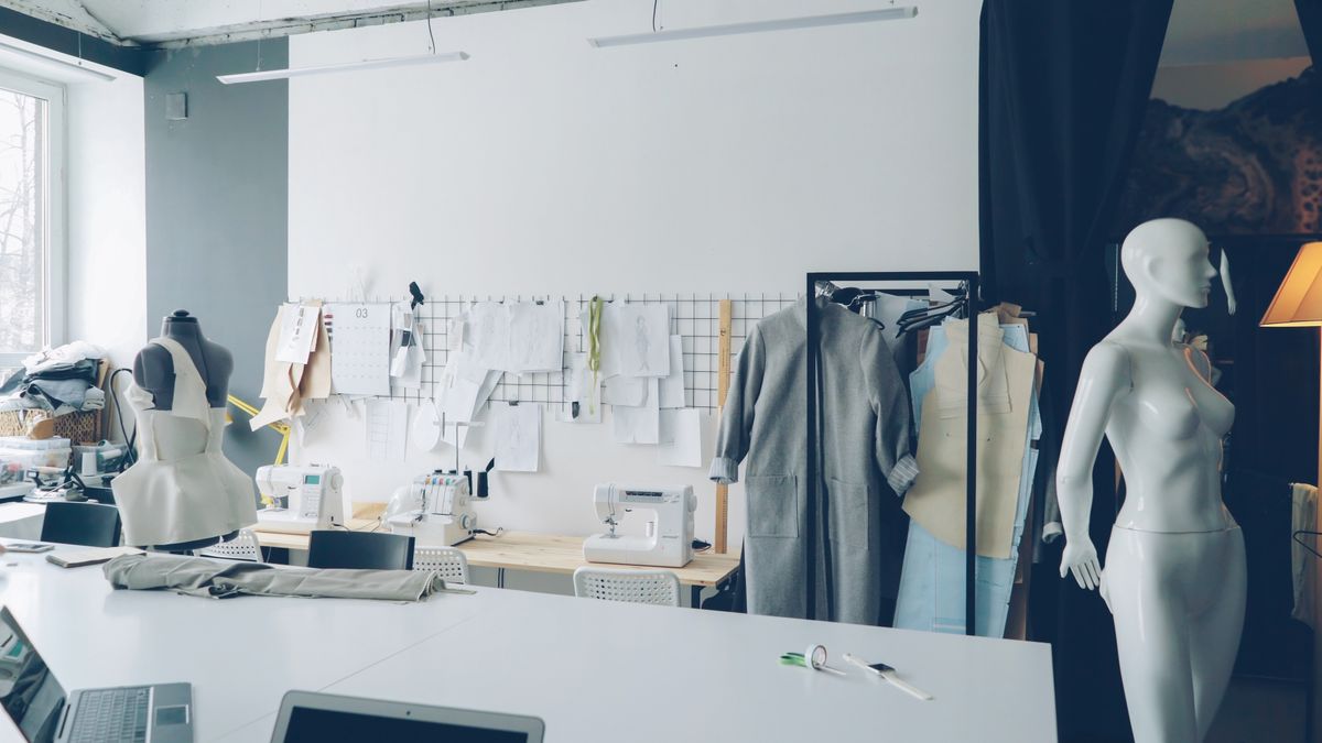Modern fashion design studio with mannequins and sewing equipment