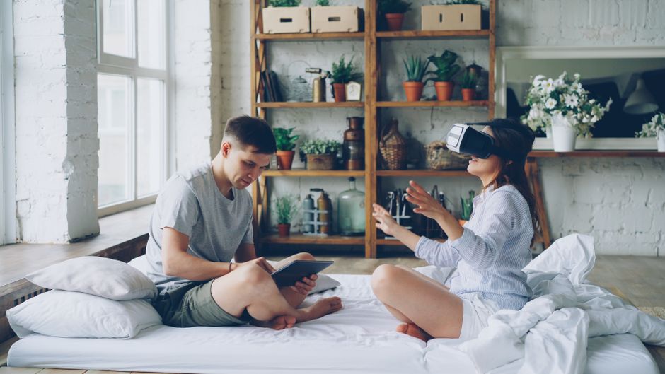 Couple enjoying virtual reality and reading in modern cozy home interior. - Long Term Value and Maintenance