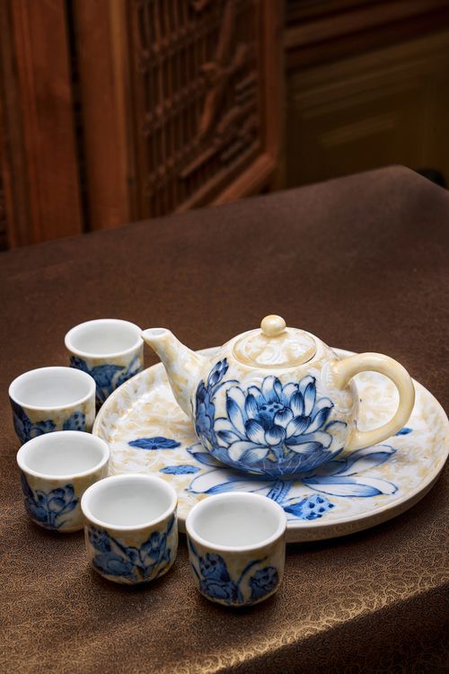 Free Beautiful ceramic tea set with floral patterns featuring a teapot and cups on display. Stock Photo