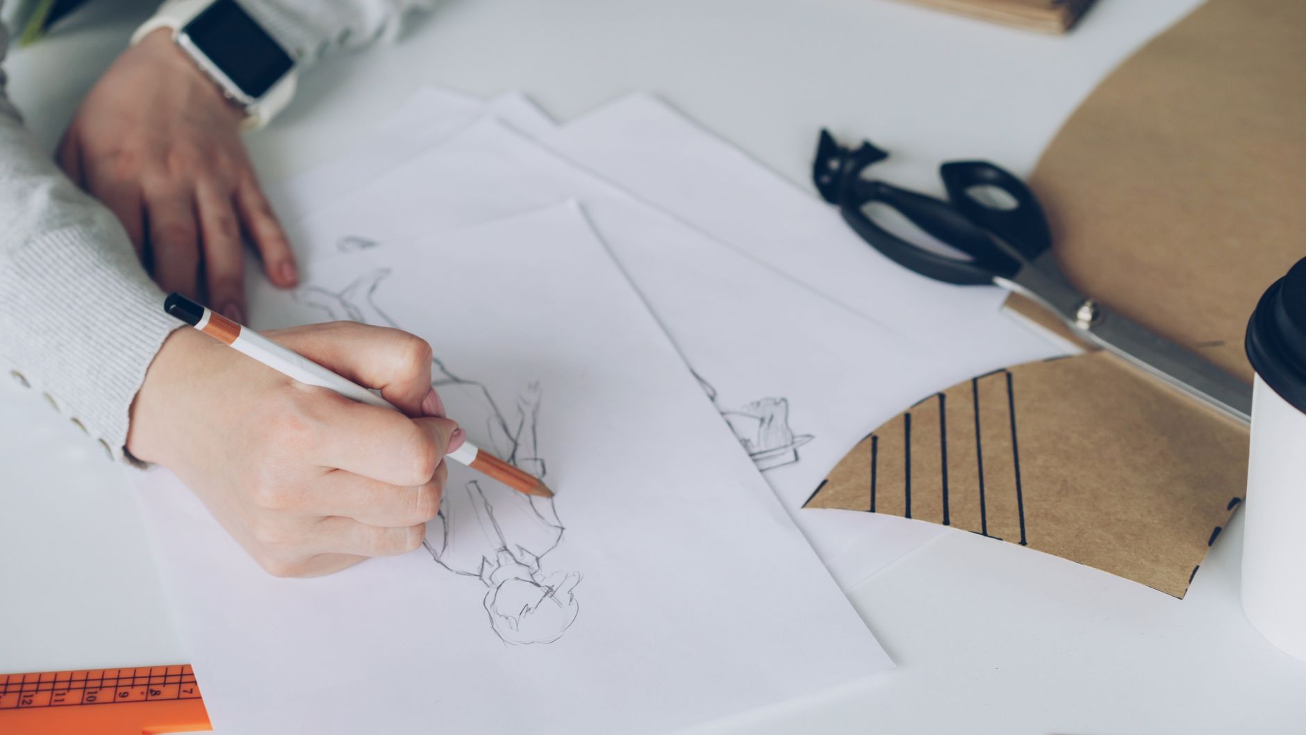A design studio wall covered in sketches and layout notes