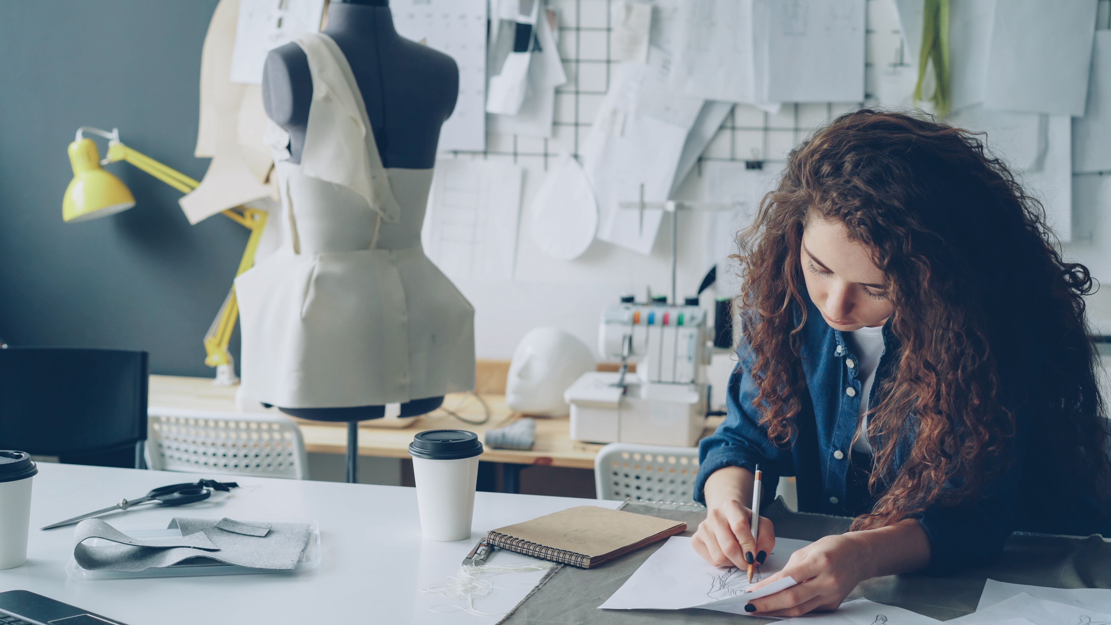 Female Fashion Designer Sketching in Studio · Free Stock Photo