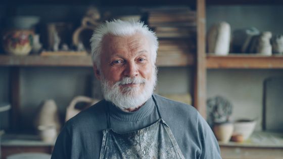 Senior potter smiling in his workshop — photo by Vitaly Gariev on Pexels
