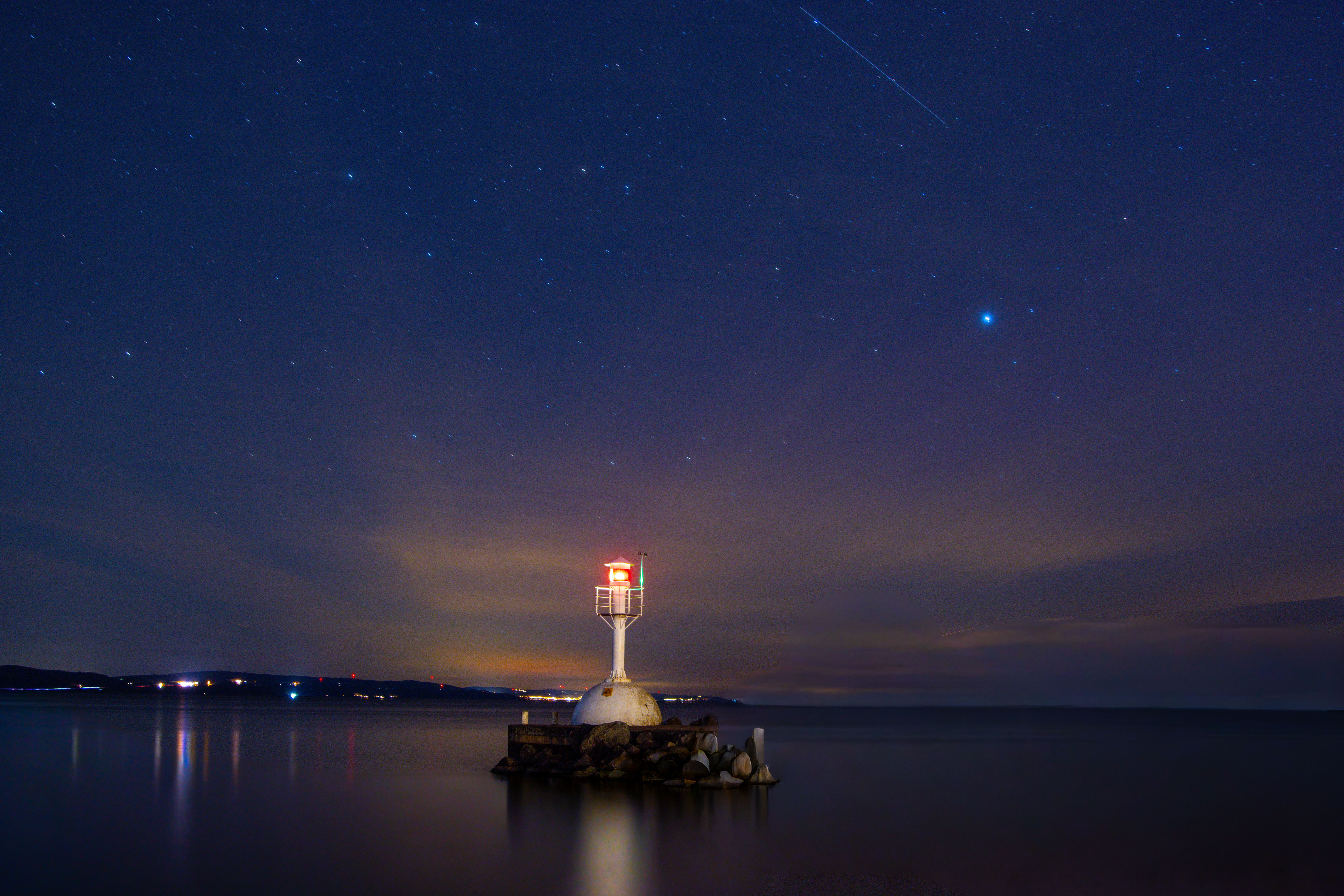 Lighthouse Under Starry Night Sky in Sweden · Free Stock Photo