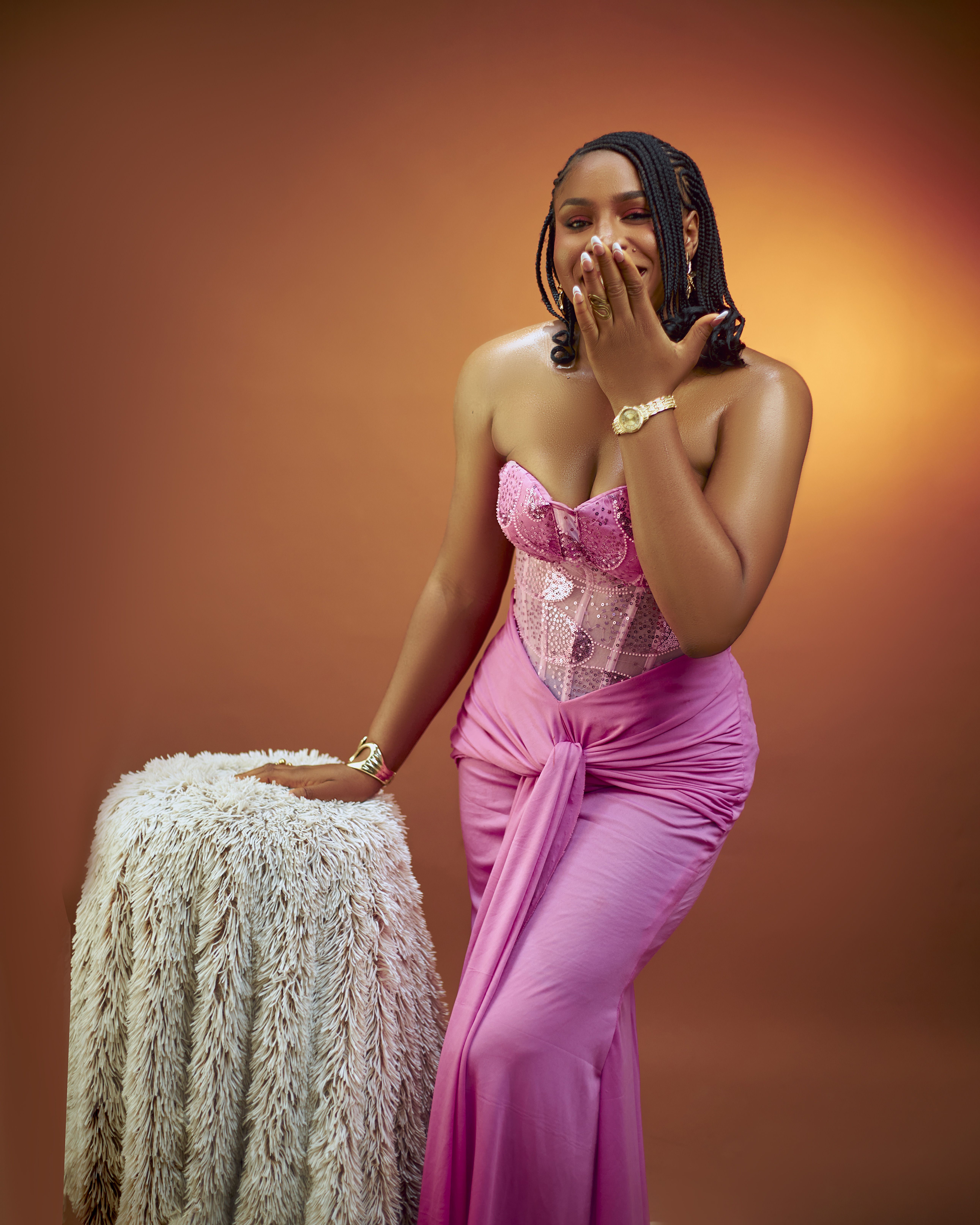 Elegant Woman in Pink Dress with Laughing Pose