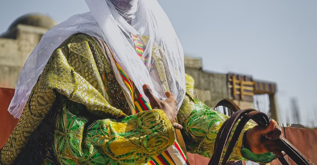 African Rider Traditional African Rider in Colorful Attire · Free Stock Photo