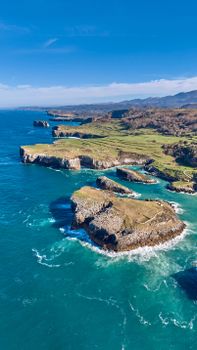 A breathtaking aerial view of Cantabria's rugged sea cliffs, showcasing natural beauty and coastal landscapes.