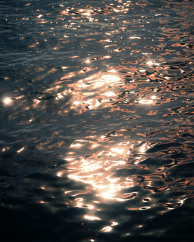 Capture of sunset reflections on the ocean in Malta, creating a warm and serene ambiance. — photo by Tobi &Chris