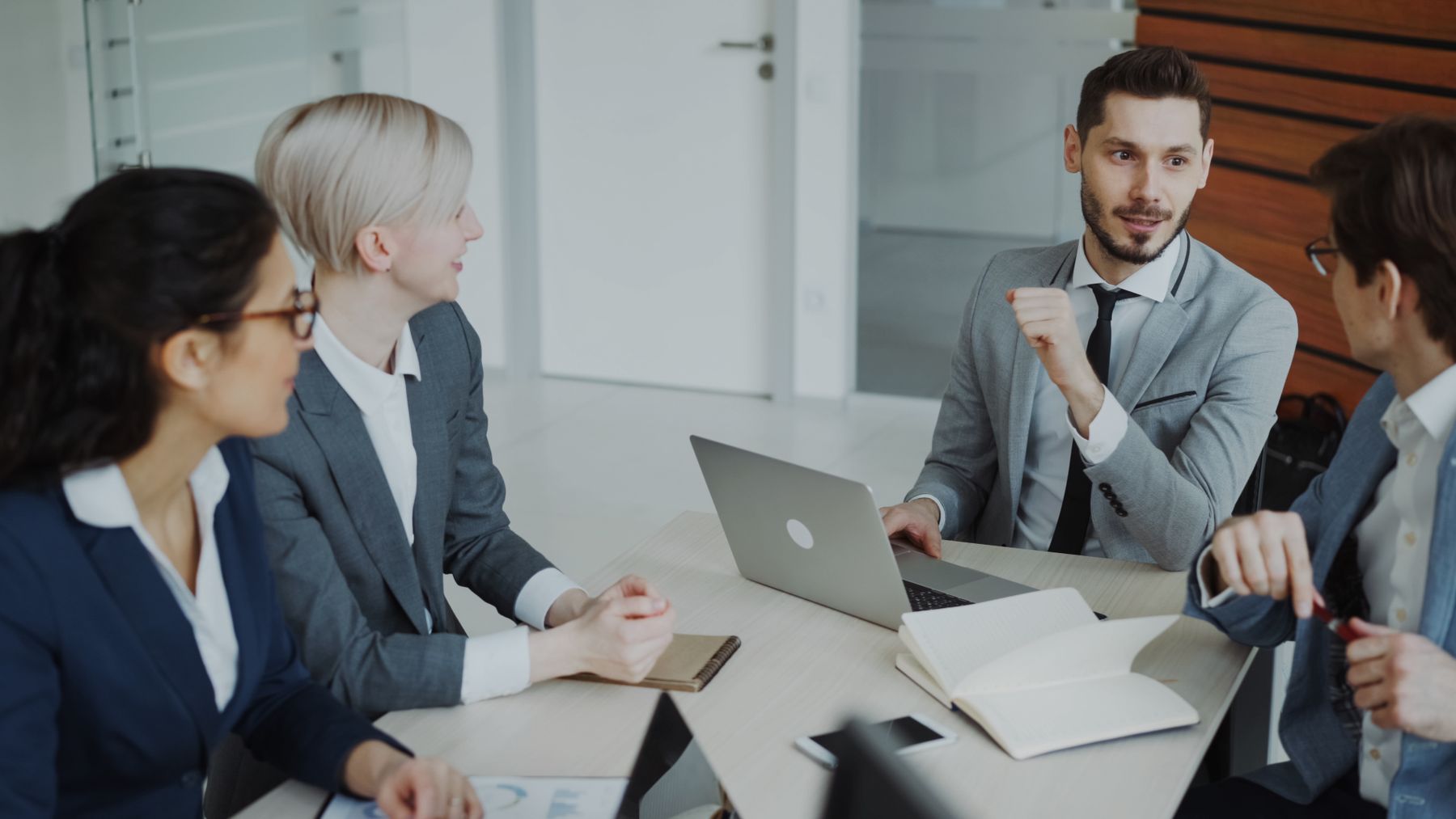 Executives holding a strategy meeting in a modern office