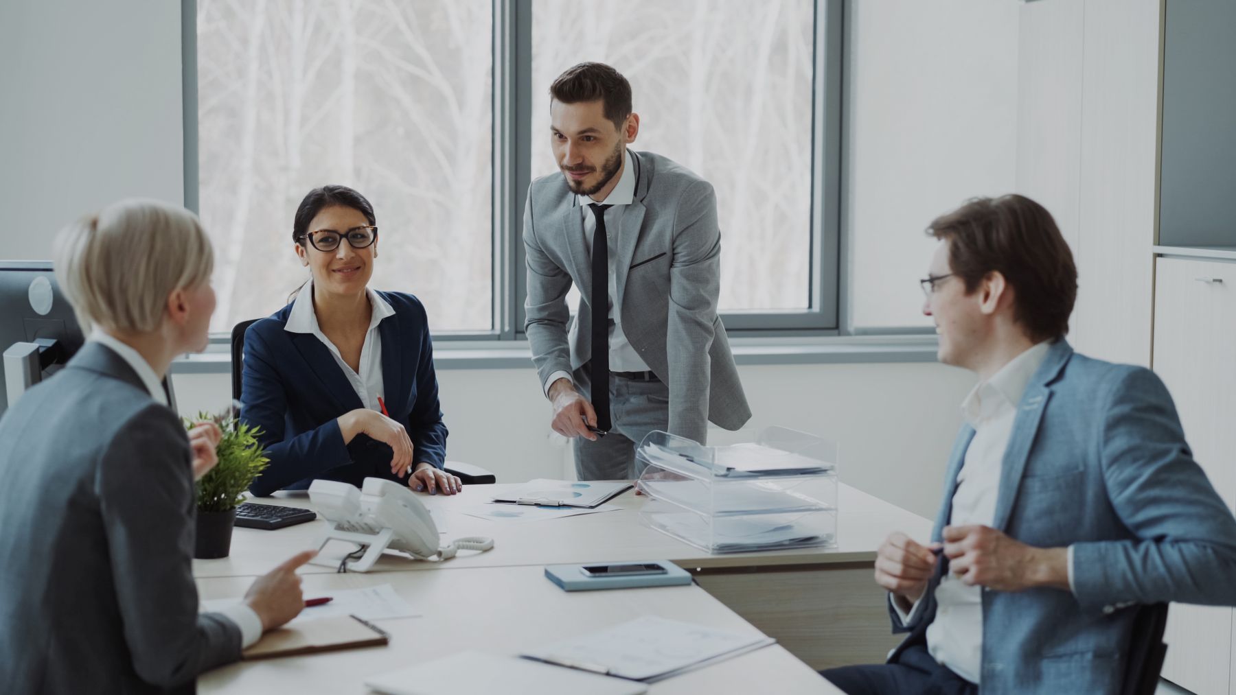 Professionals reviewing information together in a modern office