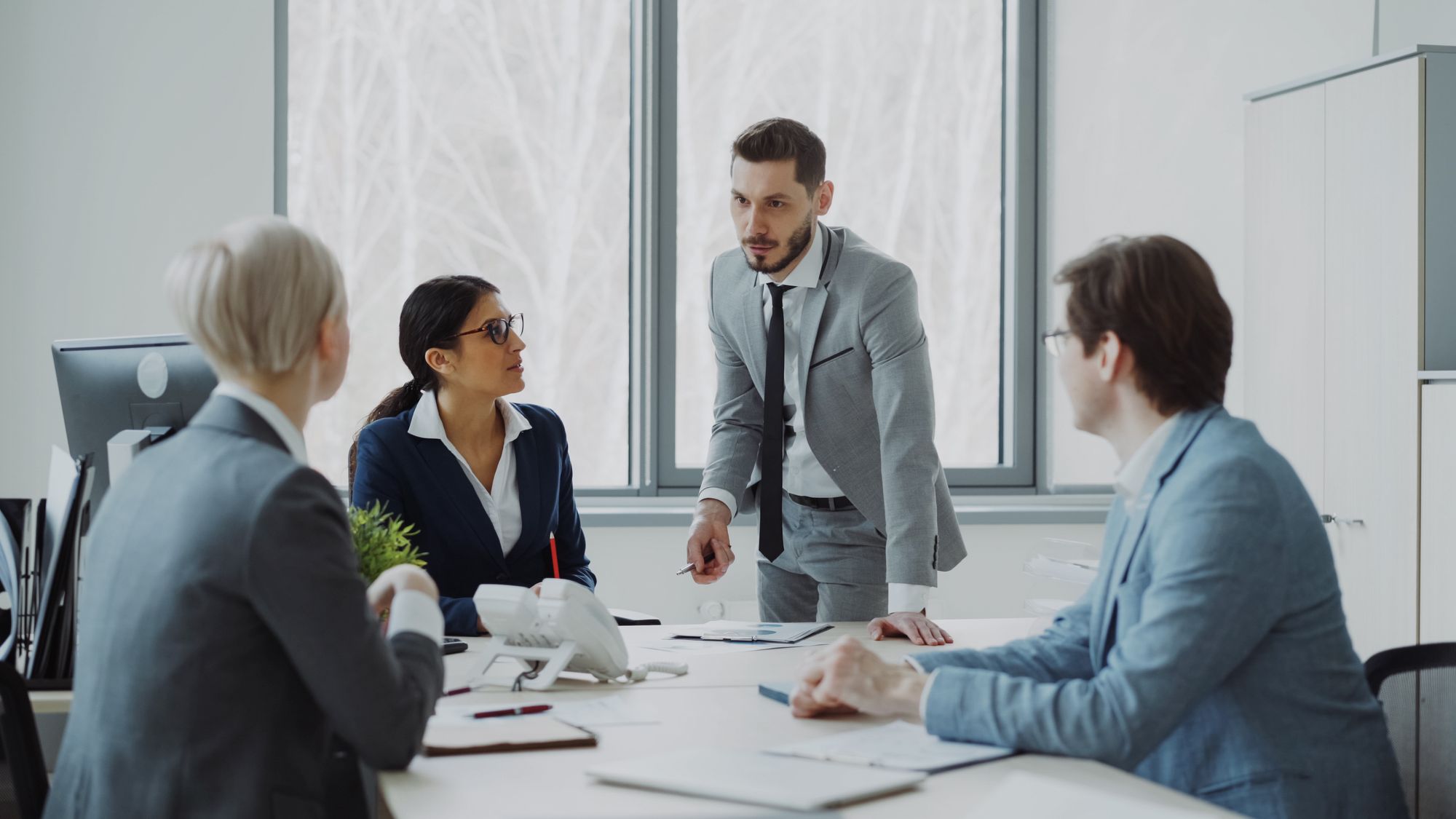 Business colleagues in a discussion around an office table