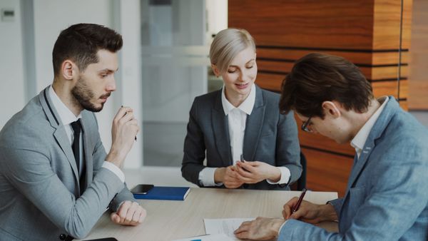 Professional team in business meeting, discussing strategy at office.