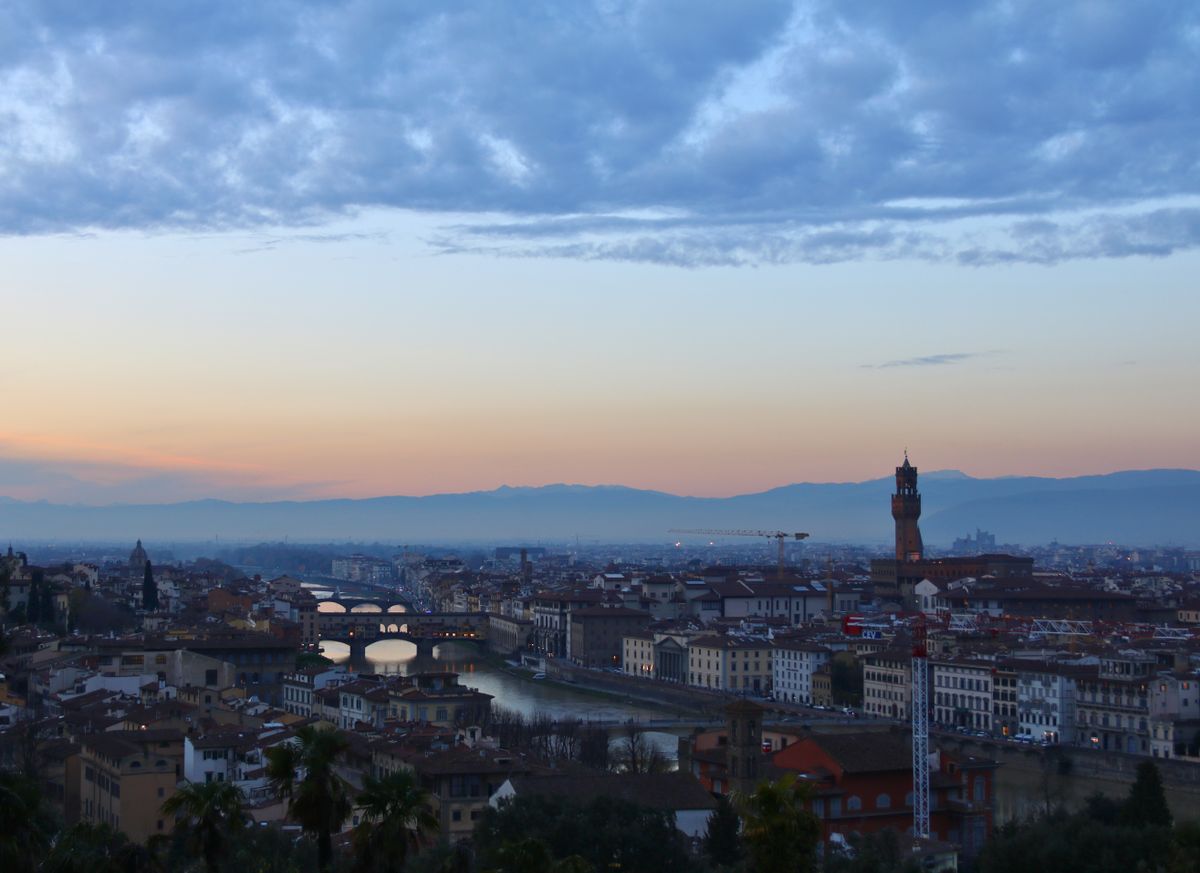 Tuscan hills sunset Florence skyline view rolling green hills purple sky