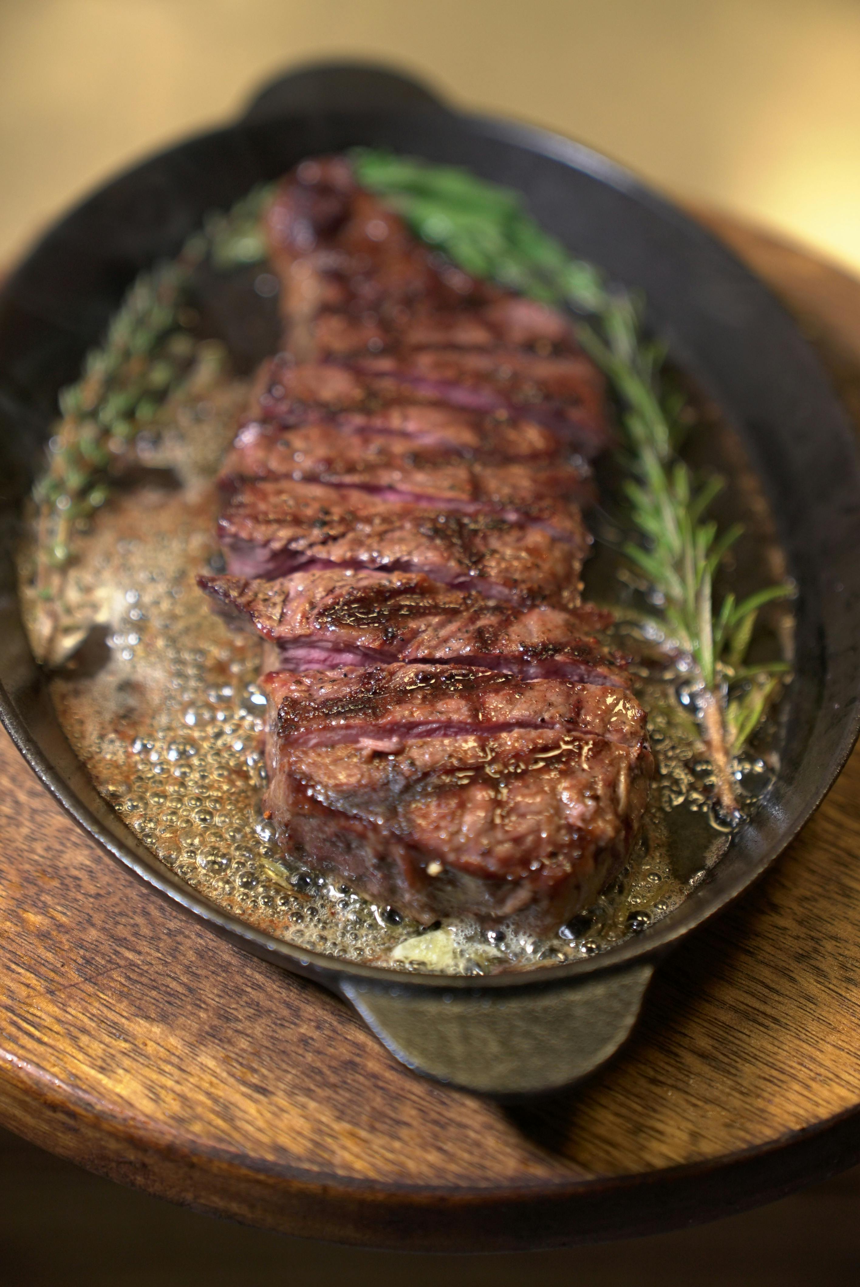 Reverse seared steak sliced showing perfect even doneness throughout