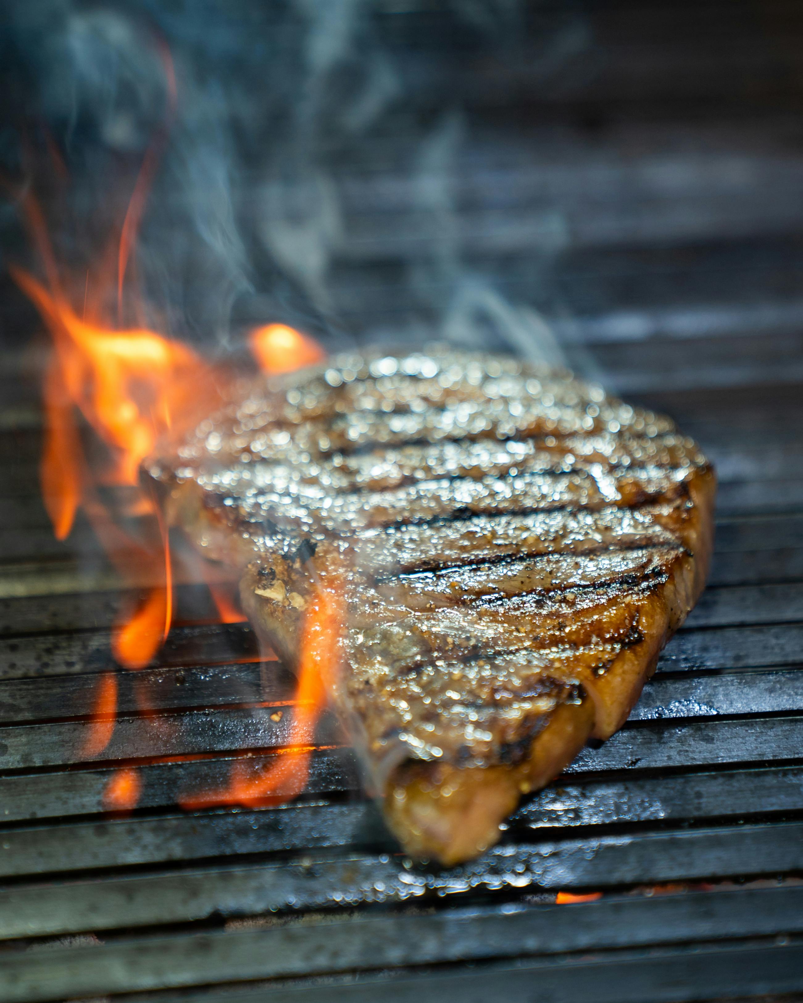 Pork ribs on grill with thermometer