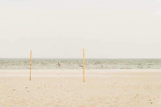 Serene view of an empty beach under a cloudy sky in Gdynia, Poland, ideal for meditation.