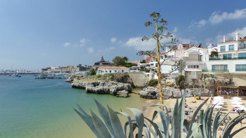 Free Beautiful seaside view of Cascais, Portugal, featuring beach and architecture on a sunny day. Stock Photo