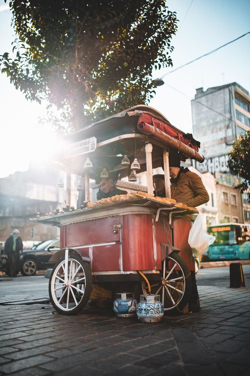 Free Low angle of old fashioned street food counter in busy street of city Stock Photo