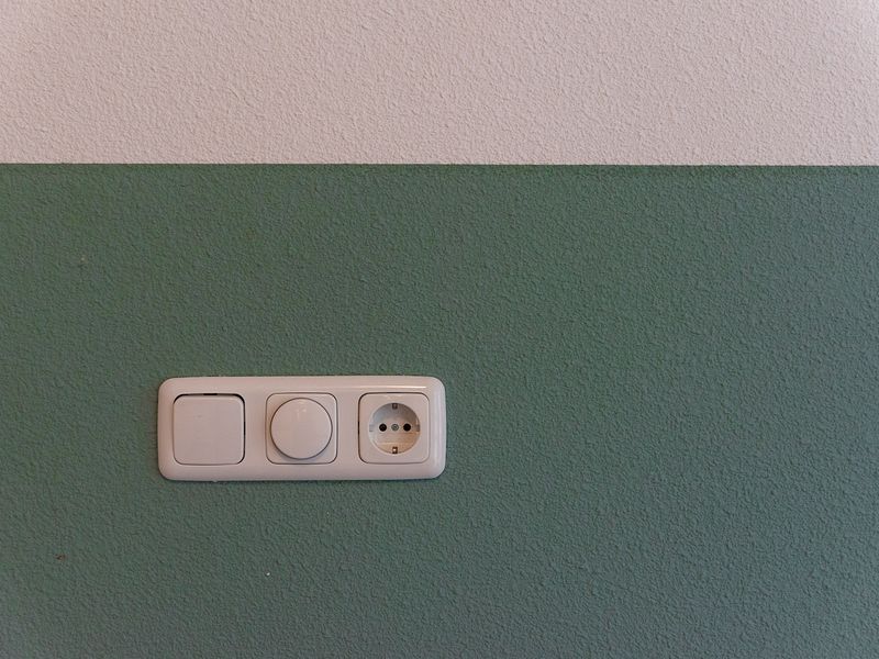 Modular power switch and socket fitted on a wall in a Nashik home