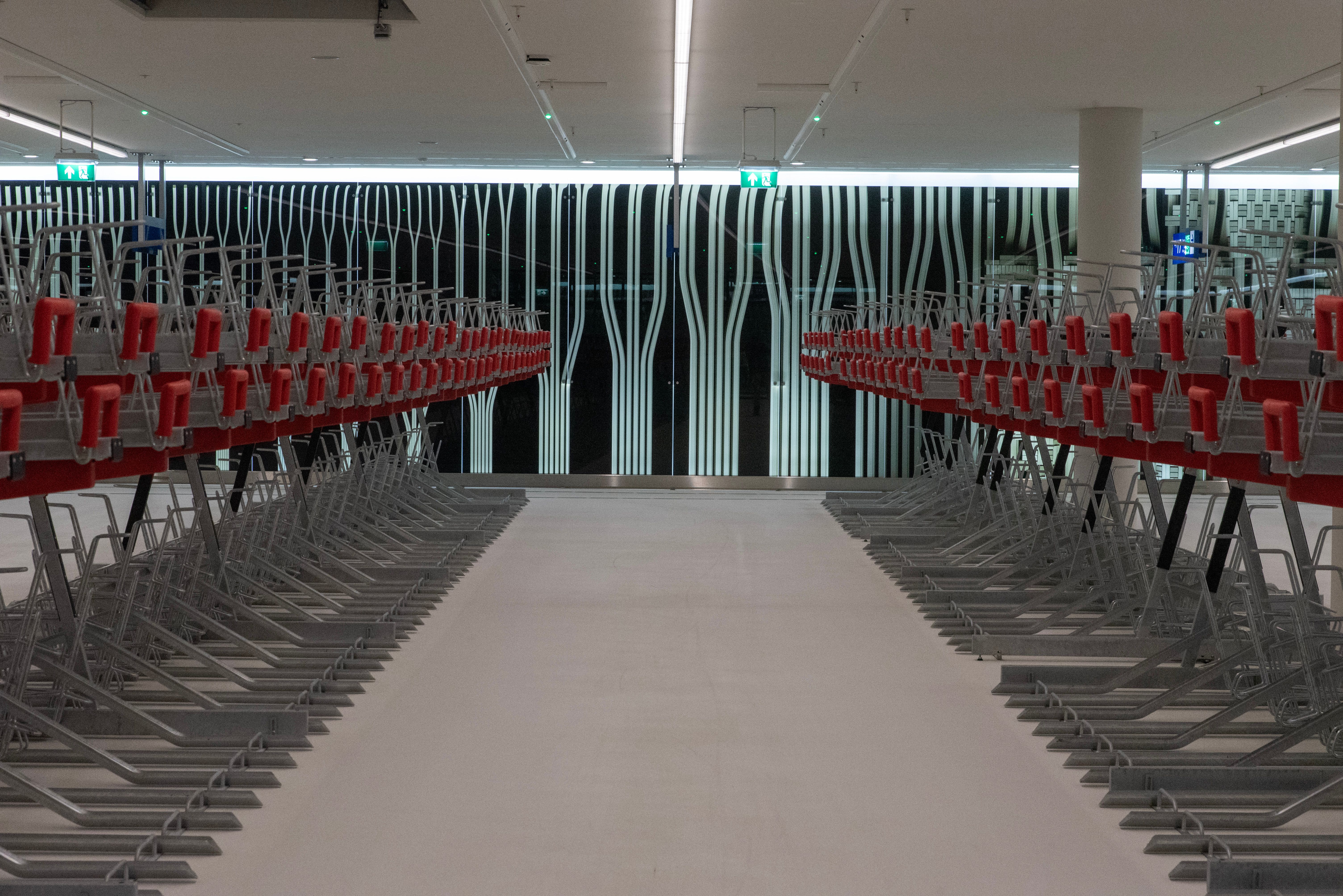Symmetrical Rows of Red and Silver Chairs Indoors · Free Stock Photo