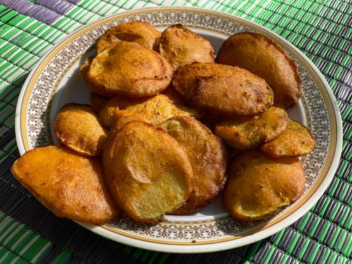 Free A plate of crispy golden pakoras, a traditional street food from Swat, Pakistan. Stock Photo