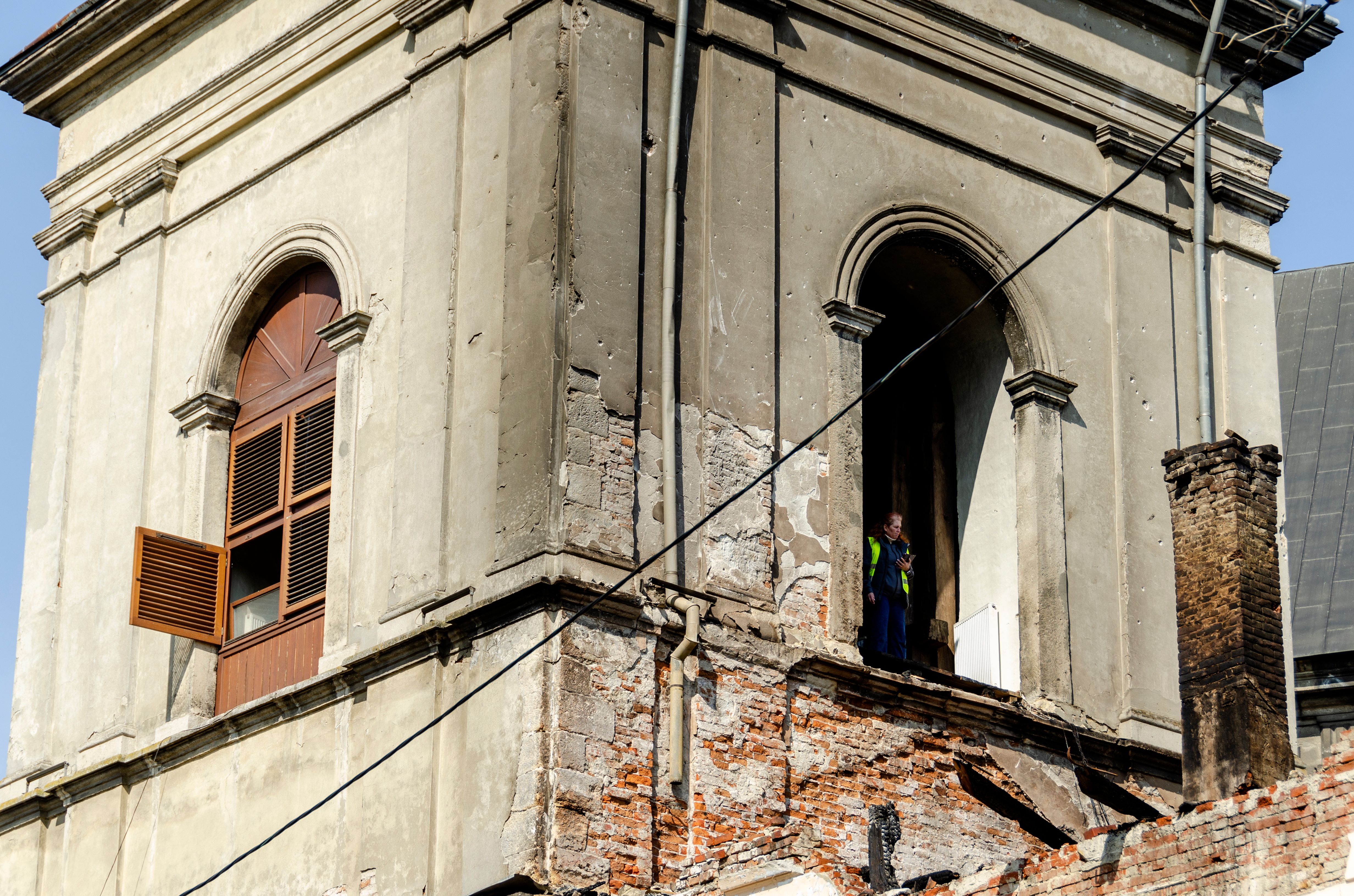 tradesperson working on historic facade