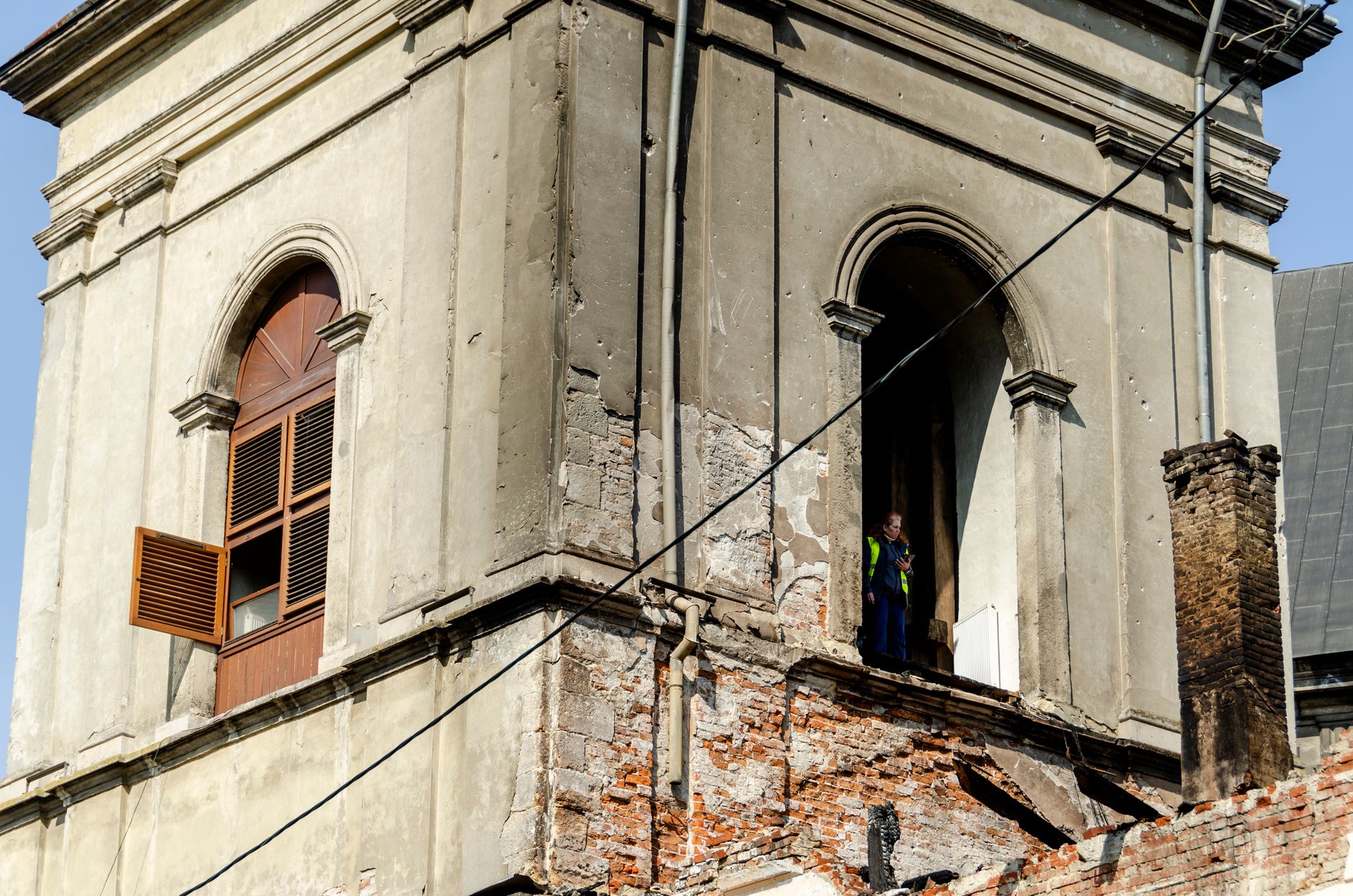 tradesperson working on historic facade