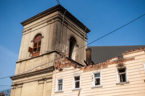 Free Close-up of a deteriorating historic building facade with blue sky in Lviv, Ukraine. Stock Photo