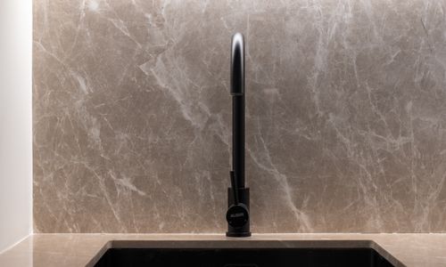 Modern kitchen sink with marble background